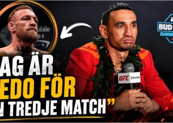 Max Holloway och Conor McGregor i UFC-buren